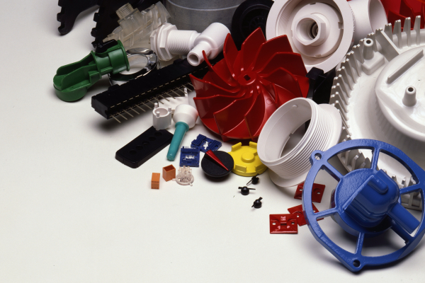 a large collection of plastic injection molded components in a wide variety of shapes, colors, and sizes